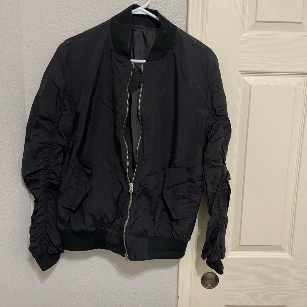 Black bomber style hip hop jacket. Size large adult